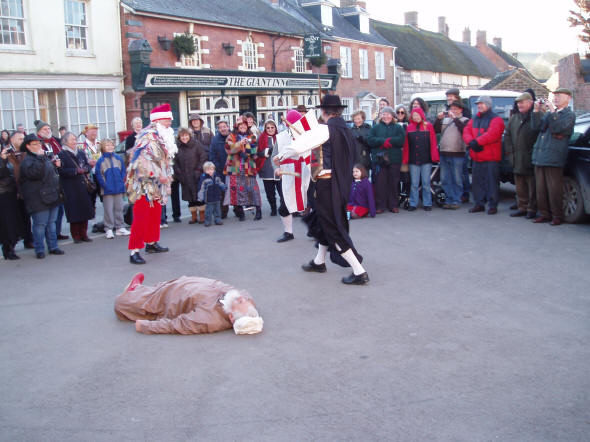 Picture of the mummers play being performed at Cerne Abbas